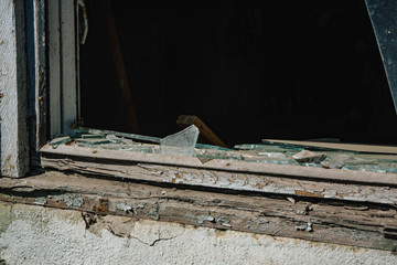 broken glass in a large, abandoned building