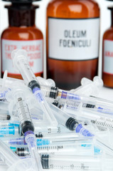 background of syringes and bottles