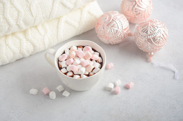 Cup of hot chocolate with marshmallows on a gray concrete background. Christmas concept.