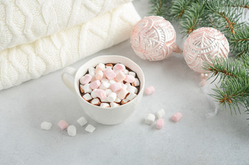 Cup of hot chocolate with marshmallows on a gray concrete background. Christmas concept.