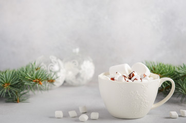 Cup of hot chocolate with marshmallows on a gray concrete background. Christmas concept.