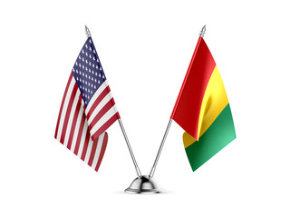 Desk flags, United States America and Guinea, isolated on white background. 3d image