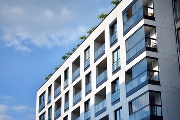 Modern and new apartment building. Multistoried modern, new and stylish living block of flats.