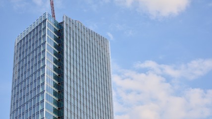 modern office building with reflection in windows