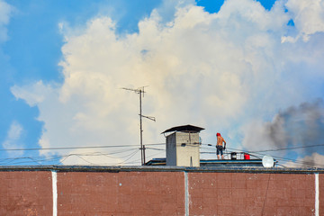 Roof repair of an old multi-storey residential building in a poor area. budget repair.