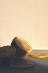 Sliced lemon on a cutting board against a light background.