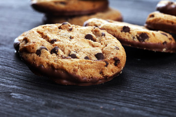 Chocolate cookies on wooden table. Chocolate chip cookies shot on table