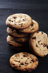 Chocolate cookies on wooden table. Chocolate chip cookies shot on table