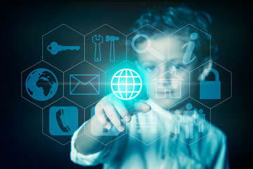 Child pressing the button with the world wide web icon on a virtual screen