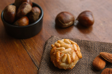 Isolated catalan panellet with some roasted chesnuts. Dia de Tots Sants in Catalunya, Spain