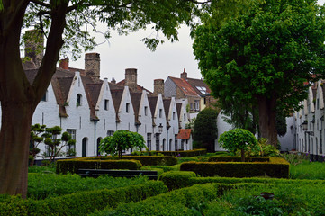 A garden surrounded with white houses