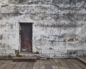 Wooden door on wall in the old town of Nanxun, Zhejiang, China
