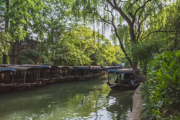 Fototapeta na wymiar Boats on river in the old town of Nanxun, Zhejiang, China