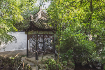 Fototapeta premium Chinese pavilion among trees in garden in Nanxun, Zhejiang, China