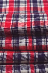 Red, blue and white tartan patterned cloth.