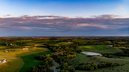 Fototapeta na wymiar Nebraska drone landscape photography of the countryside and ranch with trees and water
