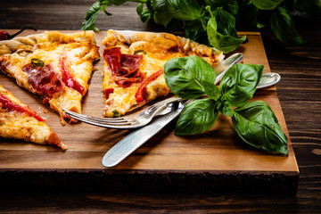 Pizza with smoked ham and pepper