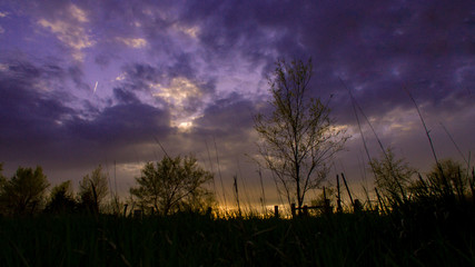 Nebraska countryside landscape trees, water, and sky with clouds