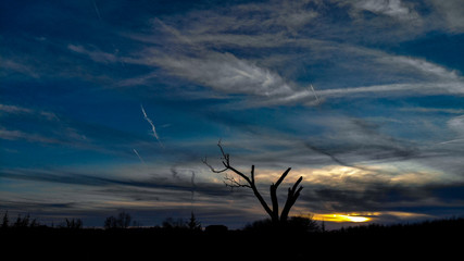 Nebraska countryside landscape trees, water, and sky with clouds