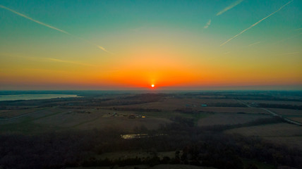 Nebraska countryside landscape trees, water, and sky with clouds