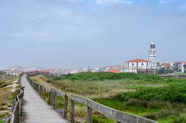 Wooden boardwalk path to the atlantic ocean beach in Costa Nova do prado, Portugal