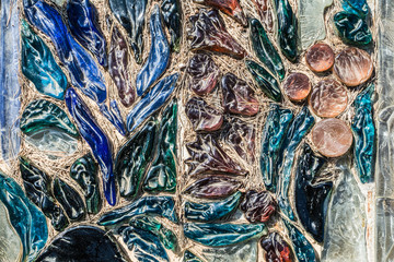 bright abstract background of old colored glass in the form of droplets, pebbles, petals