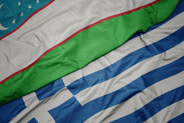 waving colorful flag of greece and national flag of uzbekistan.
