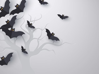 Flying bats background with copy space. 3d paper cut style. Grey background with tree silhouette for Halloween holiday. Vector illustration.
