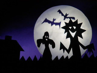 Dark Halloween season background, scary creatures silhouettes against fool moon background, ghost, bats, funny monster.