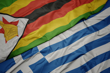waving colorful flag of greece and national flag of zimbabwe.