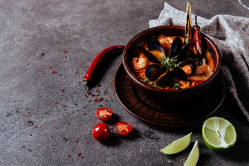 close up of a bowl of rustic italian seafood soup copy space