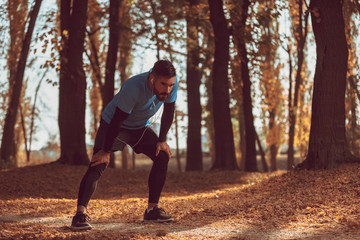 Obraz premium Handsome man are stretching before running.