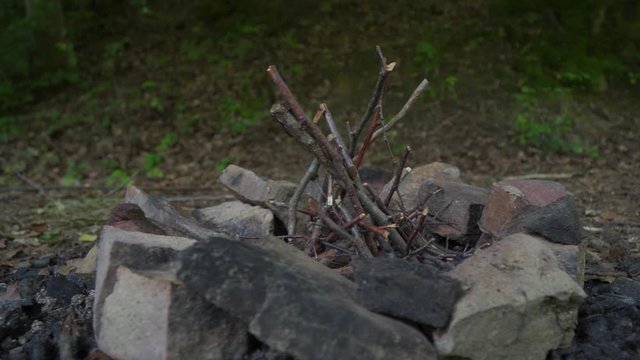 Orbit shot of tranches prepared for camp fire