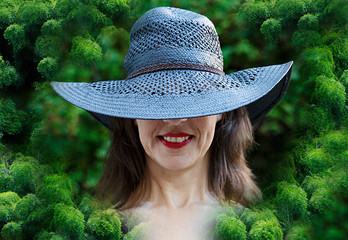 smiling woman surrounded by bamboo - Powered by Adobe
