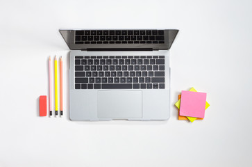 Office supplies with a laptop computer on a table