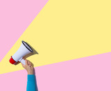 Person holding a megaphone with hard shadow