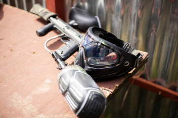 Mask to protect the face from paint shots. Sports equipment for the game of paintball. A transparent mask covering the entire face.