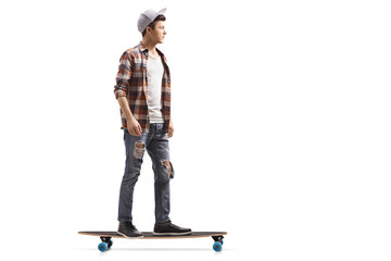 Male teenage skater on a longboard