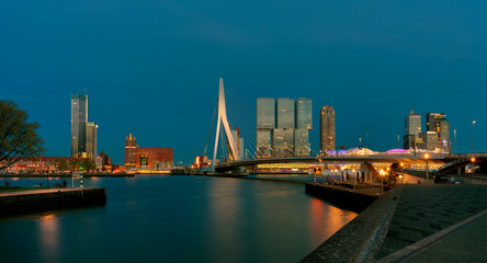 Fototapeta na wymiar Cityscape of Rotterdam at night, Erasmus Bridge.