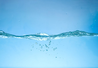 Clear fresh water wave on blue background
