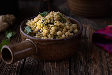 Middle Eastern Couscous and Steamed Vegetables in a Rustic Setting