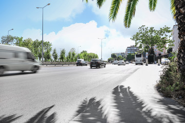 Street of modern city with cars on sunny day