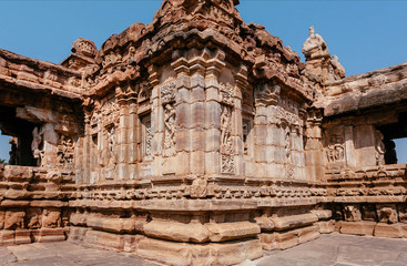 Fantastic carvings on facade of Hindu temple, sacred architecture of Pattadakal, India. UNESCO World Heritage site with traditional temples of 7th and 8th-century