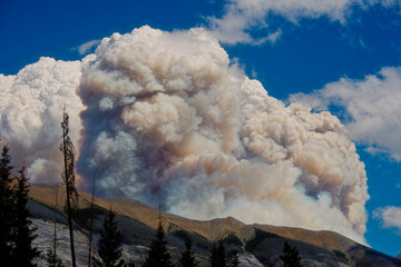 Smoke Rolls over a Mountain from Forest Fire