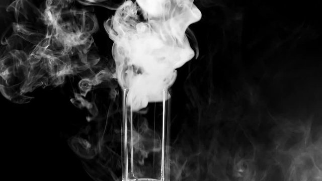 Glass Filled With Smoke. Heluin Concept. Fear. Horror. Something In Smoke. Smoke VFX Elements. Magic Halloween. Smoke On A Black Background 