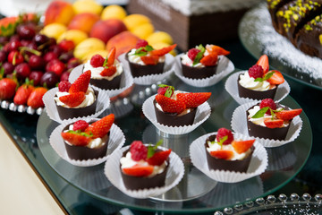 A tasty sweet dessert with creme and strawberries on a breakfast buffet at a hotel.