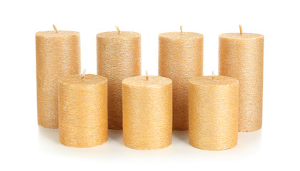 Stylish elegant gold candles on white background. Decor element