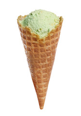 Waffle cone with sweet pistachio ice cream on white background