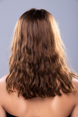 Back side view of Women to show short blonde curl Hair style before after applying hair styling, studio lighting gray background isolated, copy space for text logo