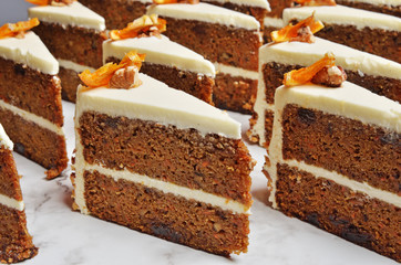 Slice of chocolate carrot cake on buffet table  